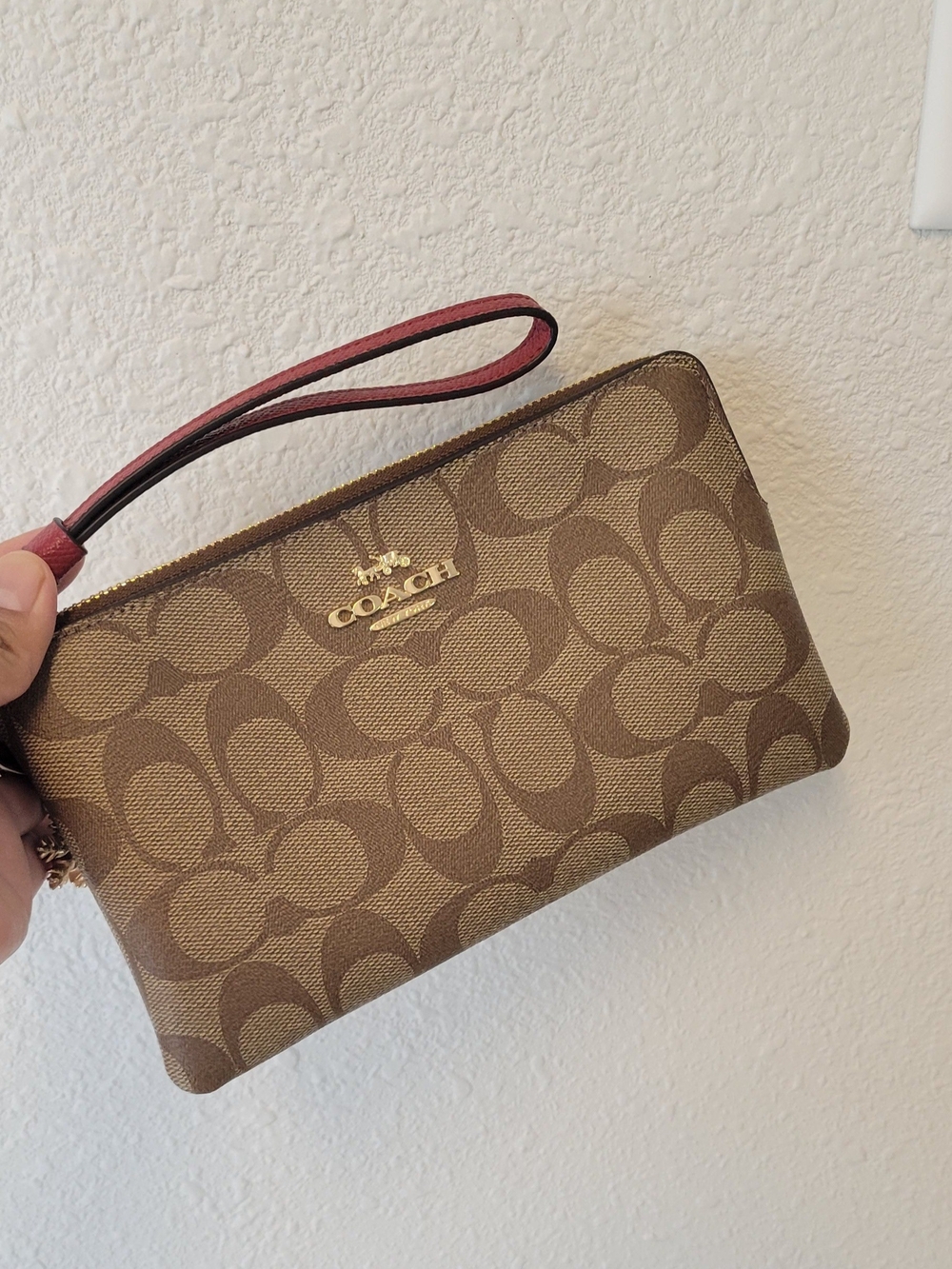 Coach Brown Signature Wristlet with Pink Strap